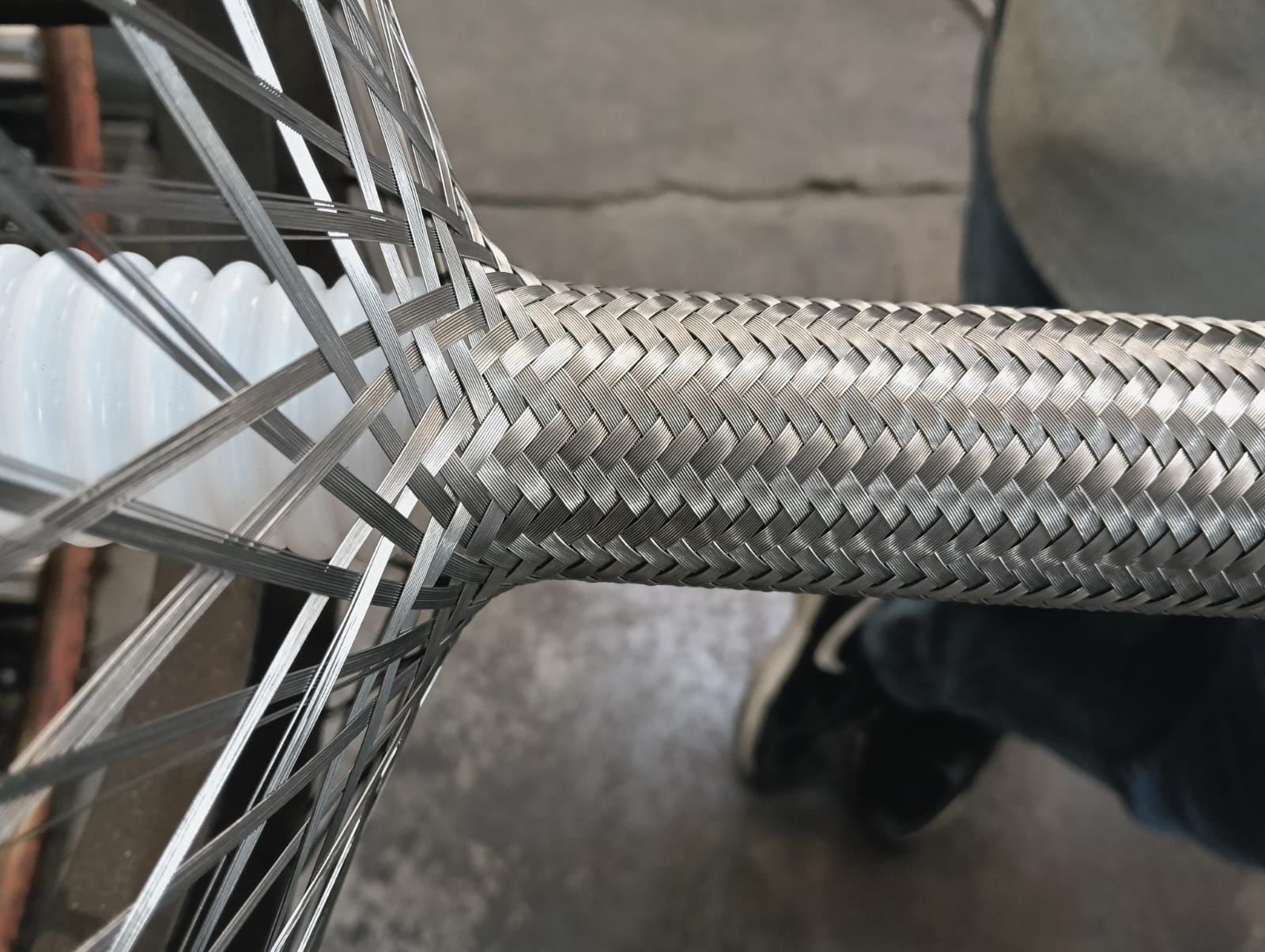PTFE hose SS wire braiding process at Flexihose India manufacturing plant in Bhiwadi Rajasthan — teflon hose with stainless steel braid being manufactured